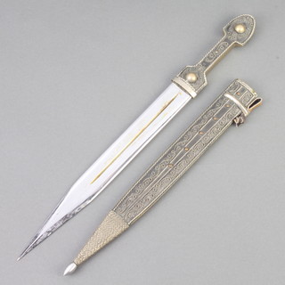 An Eastern dagger with 23cm double edge blade contained in a metal scabbard 