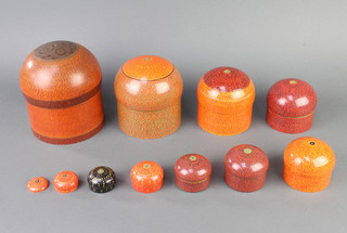 10 Eastern cylindrical lacquered nesting jars and covers together with a matching lid smallest - 1.5cm x 3cm, largest 18cm x 14cm 