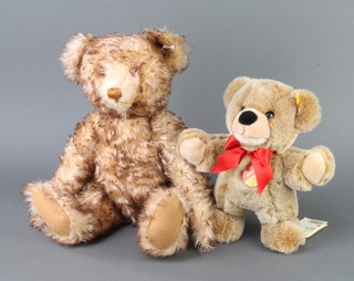 A Steiff brown and white mohair teddy bear with articulated limbs 40cm together with a brown Steiff bear 24cm 