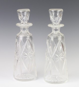A pair of tapered decanters and stoppers 30cm 