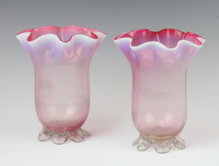 A pair of Victorian vaseline glass vases with wavy rims 16cm 