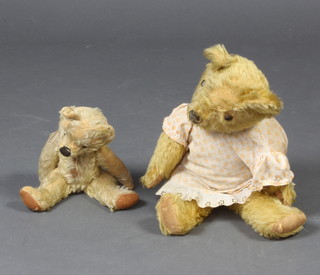 A yellow bear with articulated limbs 32cm (some wear to the body) and 1 other 50cm 