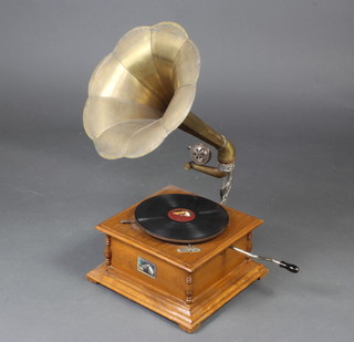 A reproduction His Masters Voice horn gramophone with pressed brass horn, together with a collection of various 78rpm records 