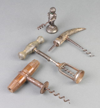A 19th Century polished steel corkscrew with carved bone handle together with 3 other corkscrews