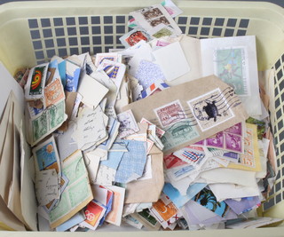 A quantity of loose world stamps on paper 