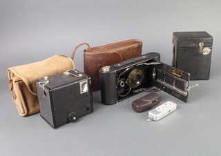A Minox spy camera, a no. C2 Brownie folding camera, a no.120 box camera and a Brownie model C box camera 