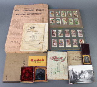 Two early black and white photographs of a lady and gentleman, 2 albums of  Wills cigarette cards and other ephemera 