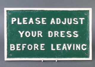 A rectangular cast iron sign marked "Please adjust your dress before leaving" 22cm x 37cm 