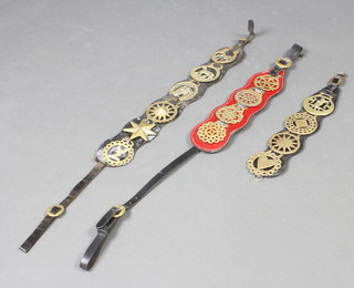 A red leather Martingale hung 4 horse brasses together with 3 other later Martingales hung 12 various horse brasses 