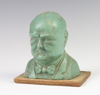 A Second World War resin Churchill Save for Victory money box in the form of a portrait bust of Churchill raised on a wooden base 13cm x 13cm x 9cm 