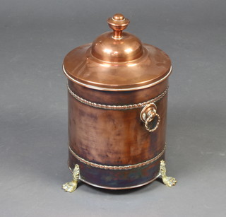 An Art Nouveau cylindrical copper and brass coal bin with ring drop handles, raised on paw feet 46cm h x 26cm diam. 