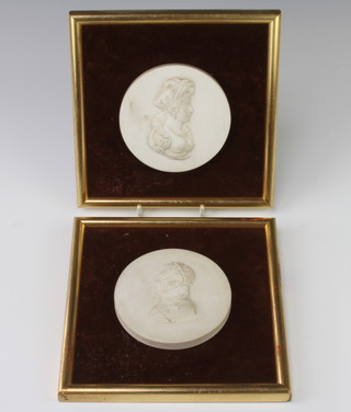 A pair of Victorian bisque circular portrait plaques of a lady and gentleman 10cm 
