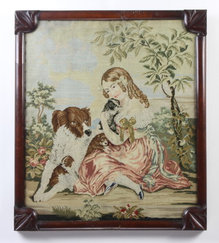 A Victorian woolwork panel of a young girl with dog and puppies in a mahogany frame 51cm x 43cm 