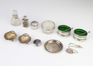 A pair of Victorian cast silver shell shape salts on ball feet, Birmingham 1876, another pair and minor silver mounted items, weighable silver 75 grams 
