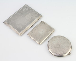A large engine turned silver cigarette case Birmingham 1926, a smaller ditto Birmingham 1933 and a sterling engine turned compact, gross 326 grams 