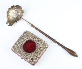 An Edwardian silver repousse watch holder Chester 1902 together with a Georgian silver punch ladle with turned wood handle 