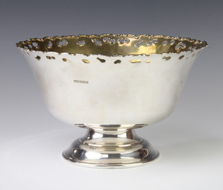 A stylish silver pedestal punch bowl with gilt interior on spread foot, Sheffield 1995, 29cm, 1255 grams 