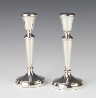 A pair of tapered silver candlesticks of plain form, Birmingham 1985, 19cm, gross 187 grams