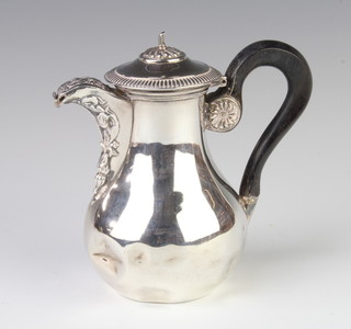 A Continental silver chocolate pot with repousse decoration and ebony handle, 211 grams gross 