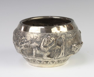 An Indian repousse silver bowl decorated with figures and elephants in a landscape setting, 12cm, 165 grams