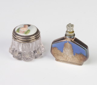 An Edwardian silver mounted toilet jar with enamelled lid and an overlaid silver scent bottle 