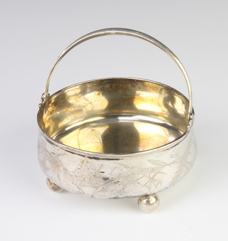 A Russian silver 84 standard swing handled basket decorated with flowers, raised on ball feet 133 grams, 11cm 
