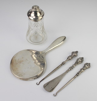 A circular silver hand mirror Birmingham 1949 and 4 mounted items 