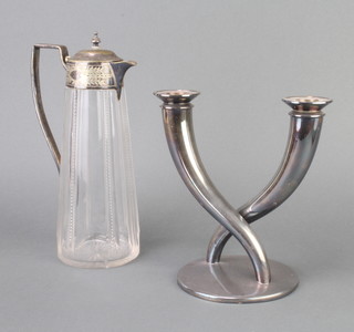 An Edwardian silver plated mounted glass ewer and a 2 light candelabrum 