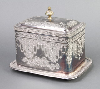 An Edwardian silver plated biscuit box decorated with scrolls 
