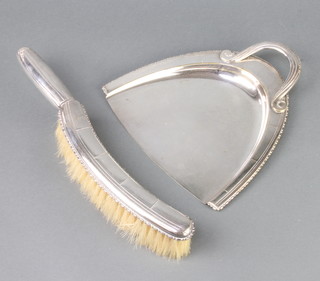 An Art Deco silver plated chrome scoop and brush 