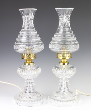 A pair of Waterford Crystal table lamps with waisted hobnail cut shades and splayed bases 50cm 