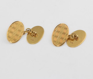 A pair of 18ct yellow gold engine turned oval cufflinks 5.9 grams 