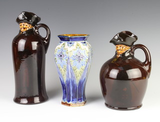 A Royal Doulton flask in the form of a gentleman 26cm, a small ditto 20cm and a hexagonal vase 20cm 