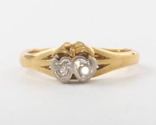 An 18ct yellow gold 2 stone diamond ring, size L, 3.2 grams