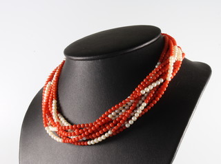An 8 strand seed pearl and coral bead necklace with a yellow gold clasp 42cm 