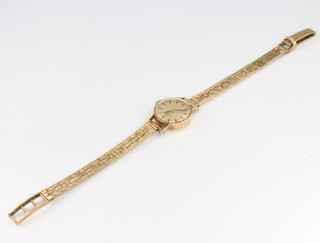 A lady's yellow gold Omega wristwatch and strap 15 grams 