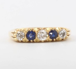 An 18ct yellow gold sapphire and diamond half hoop ring, size Q 