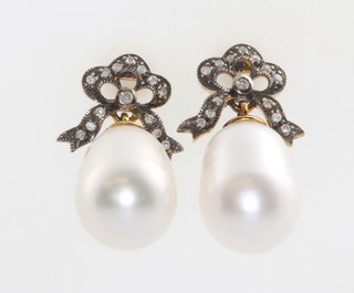 A pair of silver gilt cultured pearl and diamond earrings 