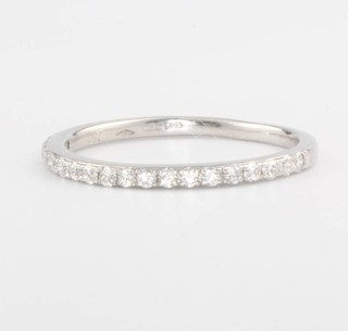 An 18ct white gold half hoop diamond eternity ring 0.21ct, size K 1/2