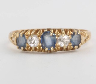 An 18ct yellow gold sapphire and diamond ring size T 