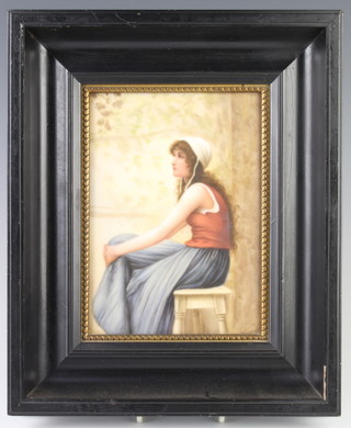 A 19th Century Continental painted porcelain panel depicting a young lady sitting on a stool, framed 18cm x 13cm 