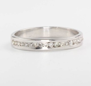 An 18ct white gold diamond half eternity ring size M 