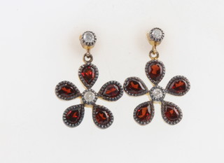 A pair of Edwardian style silver gilt garnet and diamond ear studs 
