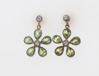 A pair of silver gilt Edwardian style peridot and diamond floral cluster earrings 
