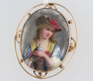 A 9ct yellow gold mounted painted porcelain brooch depicting a lady 43mm 