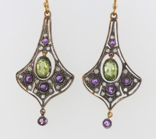 A pair of silver gilt, peridot, amethyst and diamond earrings 