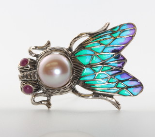 A silver pearl and enamel moth brooch 