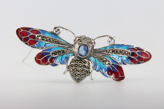 A silver enamel, sapphire, marcasite and ruby set bug brooch 
