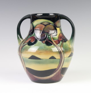 A modern Moorcroft 2 handled baluster vase decorated with a view of Ireland beneath trees 18cm dated 2006 
