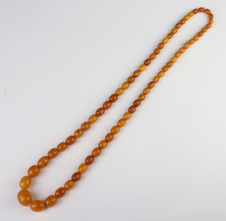 A string of amberoid beads, 66cm 